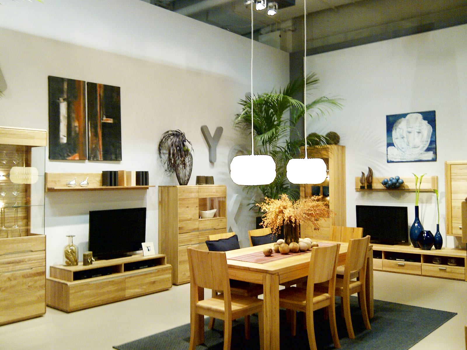 Stand in operation with visitors and pieces on display.