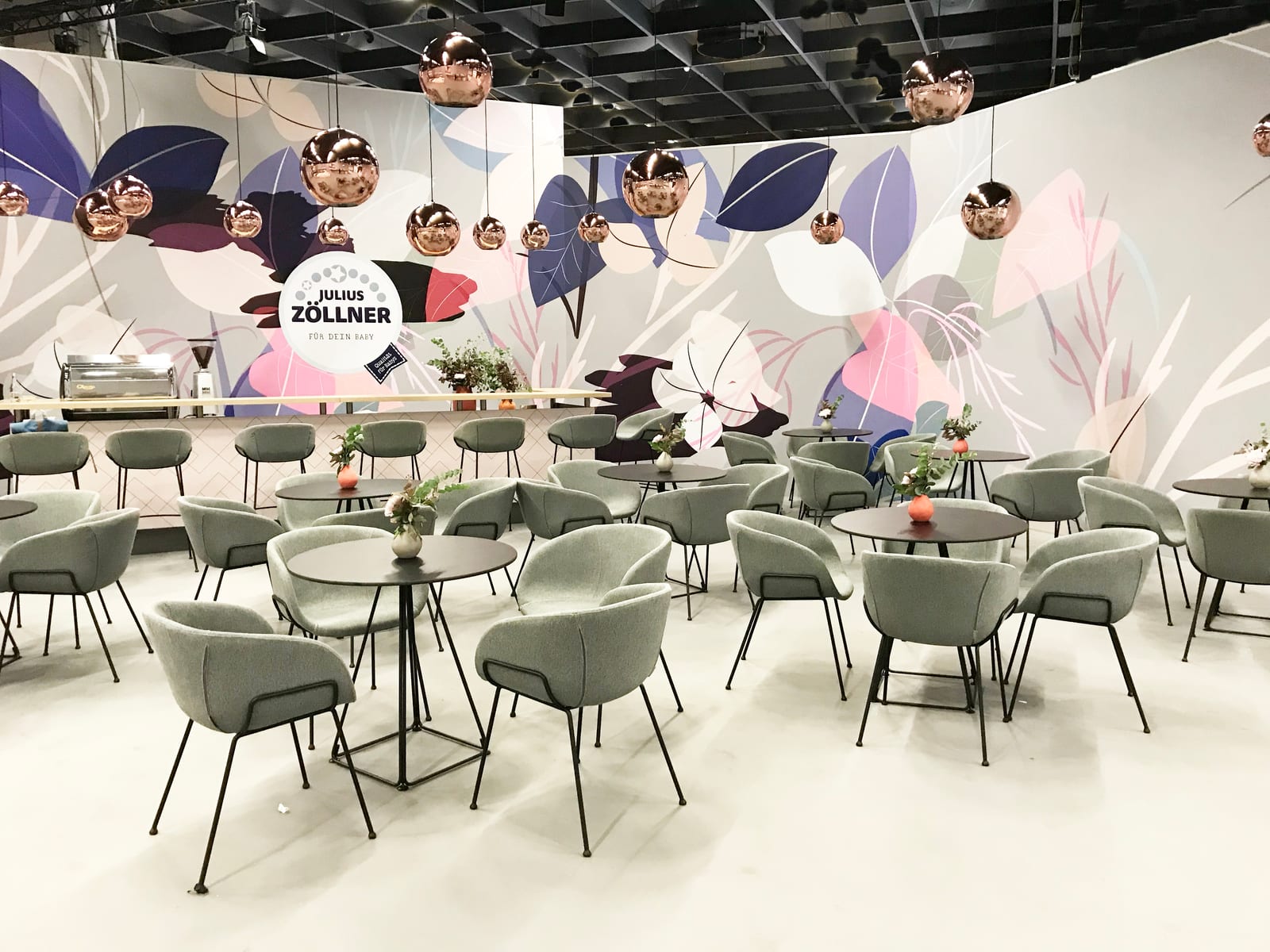 Julius Zöllner stand in a muted palette with curated product staging.