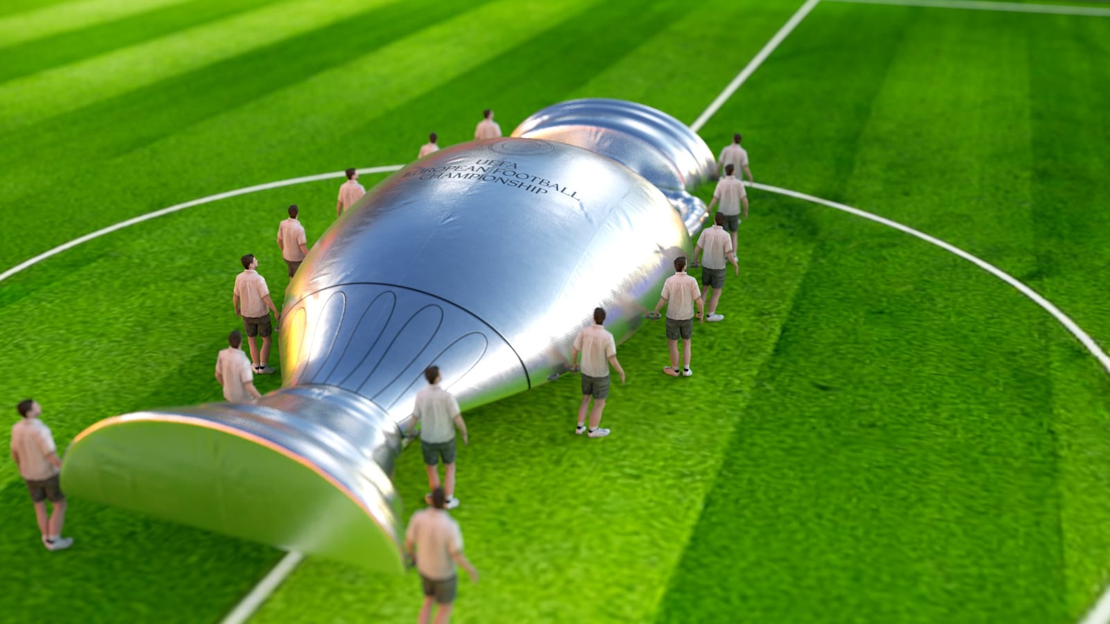 Staging of the EURO trophy as an oversized inflatable object on the pitch.